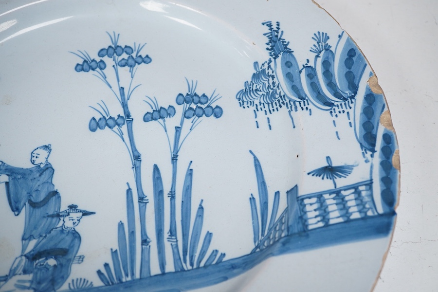 An 18th century English delftware plate, 34cm